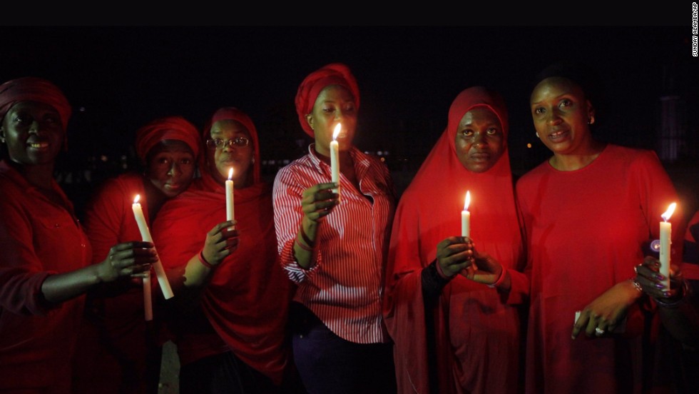 Women in Abuja hold a candlelight vigil on Wednesday, May 14, one month after the schoolgirls were kidnapped.