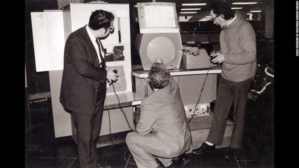 In 1962, Massachusetts Institute of Technology students Steve Russell, Martin &quot;Shag&quot; Graetz and Alan Kotok created &quot;Spacewar!&quot; which is widely considered the first interactive video game. Dueling players fired at each other&#39;s spaceships using early versions of joysticks. This photo shows the three &quot;Spacewar!&quot; inventors playing the game at Boston&#39;s Computer Museum in 1983.
