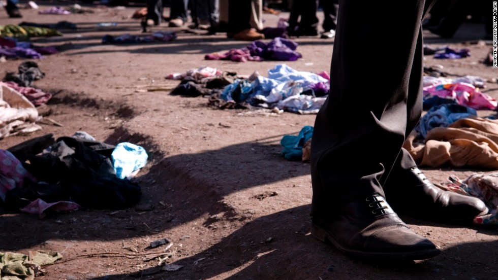 Clothes lie scattered on the ground after twin explosions in central Nairobi on Friday, May 16. Two suspects were arrested in connection with the blasts, which were caused by grenades, police said. 