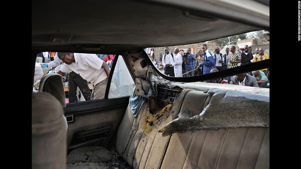 Police investigators comb through the scene of an explosion in Nairobi on May 16.