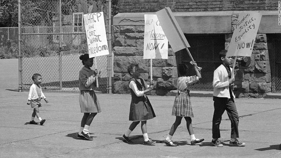 Ten years after the Supreme Court&#39;s decision, protests were still taking place. Here, 2-year-old Prentice Sharpe joins older children picketing a predominantly black elementary school in Albany, New York, on May 18, 1964.