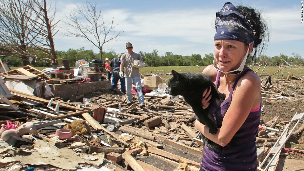 &lt;strong&gt;Then:&lt;/strong&gt; Brittany Brown rushes to get aid after finding her grandmother&#39;s cat, Kitty, on May 22, 2013. The cat was buried in the rubble for two days.
