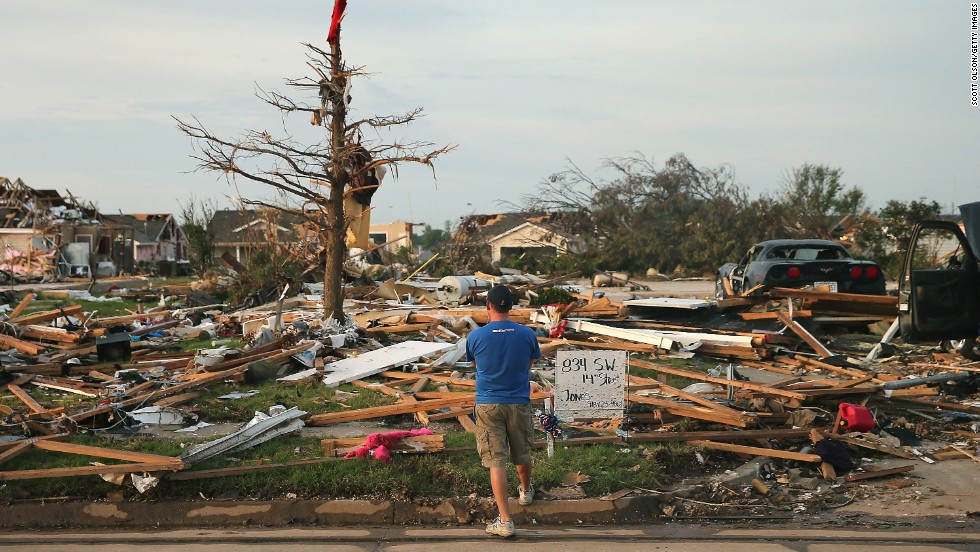 &lt;strong&gt;Then:&lt;/strong&gt; Matt Bedoe stands in front of the home of his friend and co-worker Rick Jones on May 25, 2013. Jones, a 54-year-old postal worker, died when his house collapsed during the tornado.