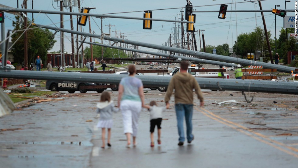 &lt;strong&gt;Then: &lt;/strong&gt;Downed utility poles block the road on May 21, 2013.