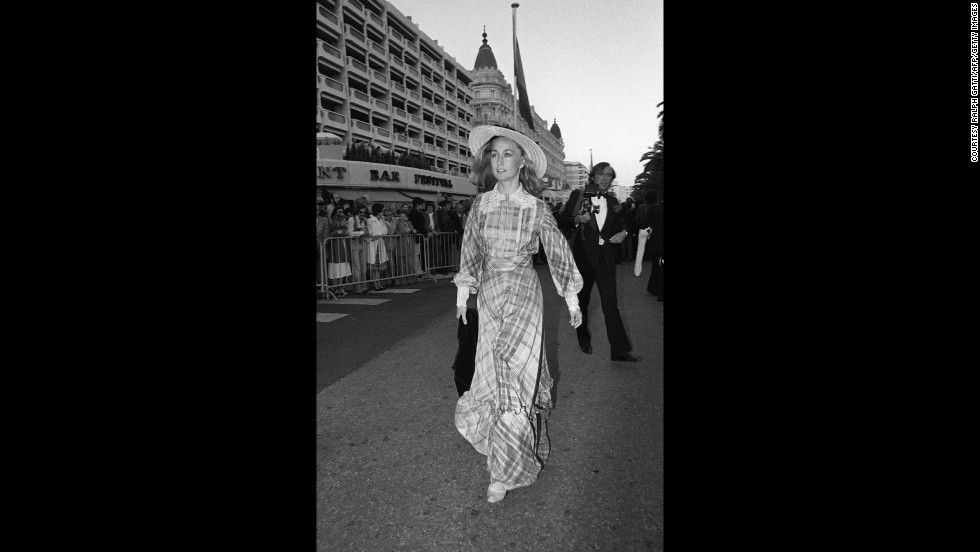 French actress Brigitte Fossey arrives at the 1977 film festival in long checked dress with lace detailing and a provincial straw hat. Fossey was just five years old when she was cast by director René Clément to star in his film, &quot;Forbidden Games.&quot; 