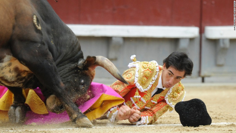 Jimenez eyes the horn of a bull as he is gored on May 20.