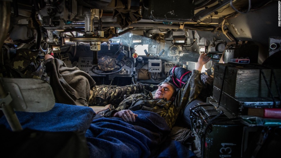 A Ukrainian soldier rests inside an armored personnel carrier at a checkpoint near Slovyansk on Wednesday, May 21. 
