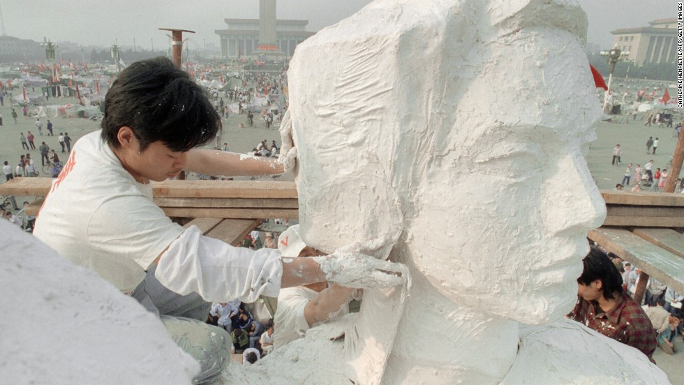 May 30, 1989, students from the Central Academy of Fine Arts create a 10-meter-tall statue of the Goddess of Democracy to boost morale amongst student protestors in Tiananmen Square. Erected in just four days, the statue was unveiled in front of the Monument to the People&#39;s Heroes.