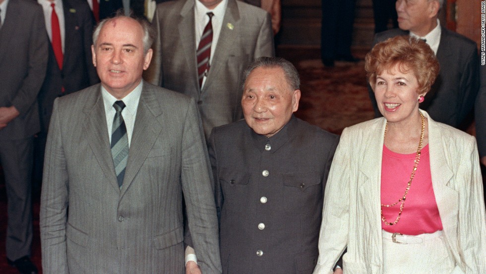 May 16, 1989, then Chinese President Deng Xiaoping (center) takes then Soviet President Mikhail Gorbachev and his wife Raisa by the hand at the Great Hall of the People. Gorbachev&#39;s visit coincided with the student hunger strikes, forcing the official reception to be moved from Tiananmen Square to the airport -- embarrassing for the Chinese leadership.