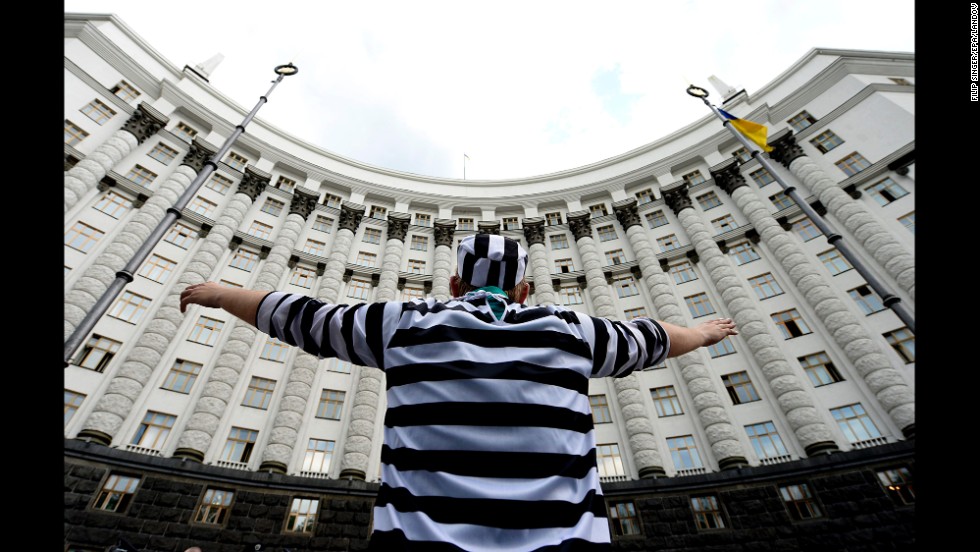 A man dressed in a prisoner costume takes part in a protest against government corruption May 27 in Kiev.
