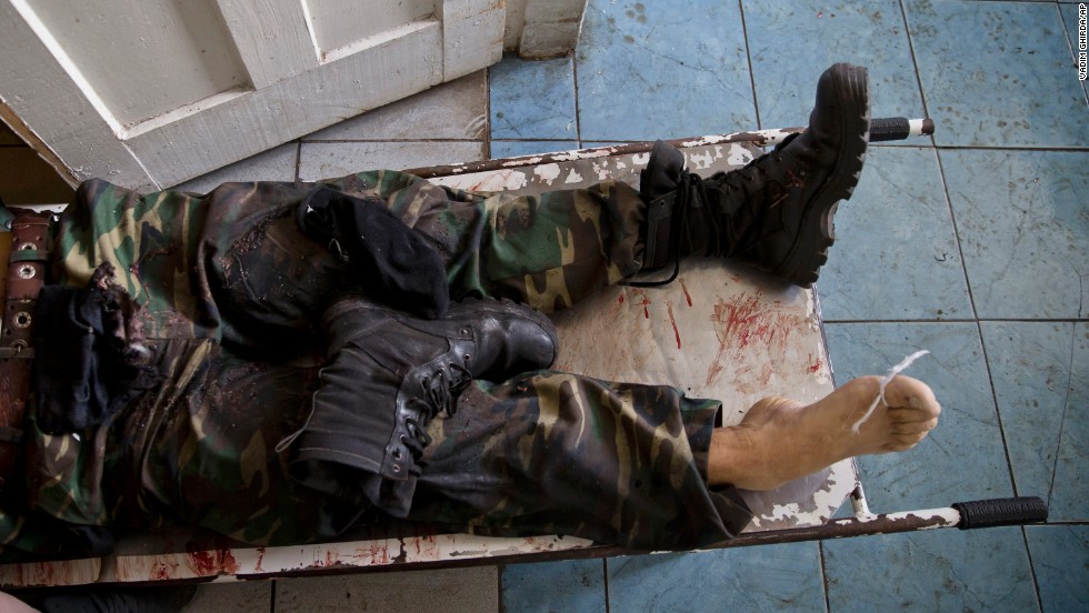 The body of a pro-Russian militant lies on a stretcher at a morgue in Donetsk on May 27. He was killed in clashes around Donetsk&#39;s airport, which was seized by pro-Russian separatists a day earlier. Ukrainian forces moved in and reclaimed the facility.