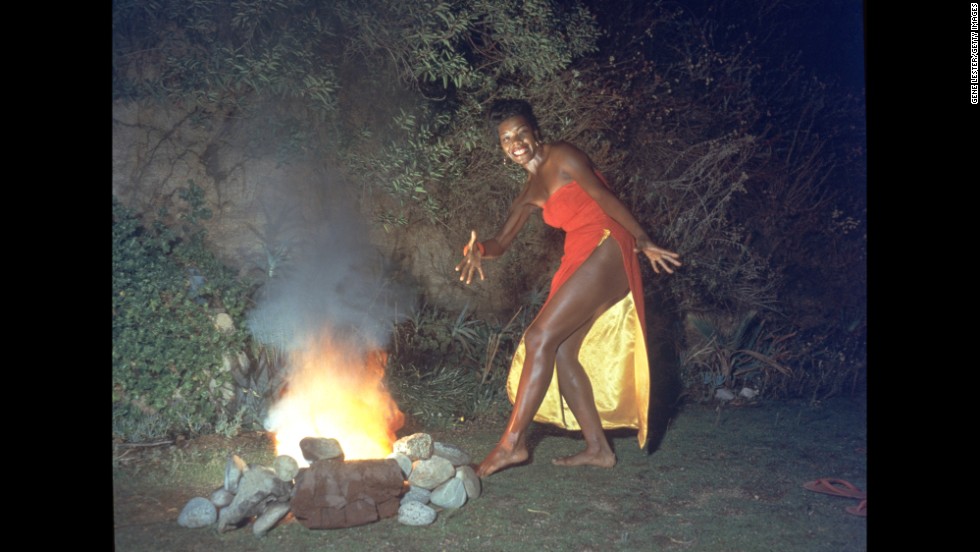 Angelou was also a professor, singer and dancer whose work spanned several generations. Here, she dances next to a fire in this promotional portrait taken for the cover of her first album, &quot;Miss Calypso,&quot; in 1957.