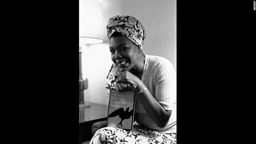 Angelou poses with her book &quot;I Know Why the Caged Bird Sings&quot; in 1971. It was the first in a series of autobiographical books.