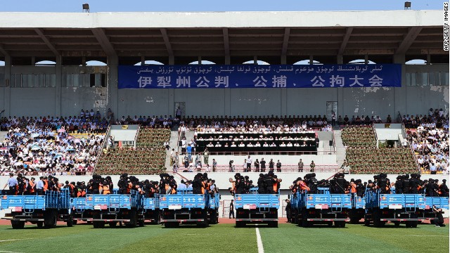 Dozens of terror suspects are found guilty before 7000 spectators at a stadium in China&#39;s Xinjiang Province.