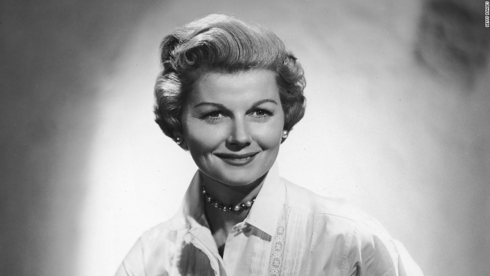 Barbara Billingsley wears pearls and a white blouse with lace stitching, her usual attire as mother and housewife June Cleaver in the 1950s show &quot;Leave it to Beaver.&quot; Female characters in &#39;60s TV moved beyond big skirts and heels into more adventurous territory.