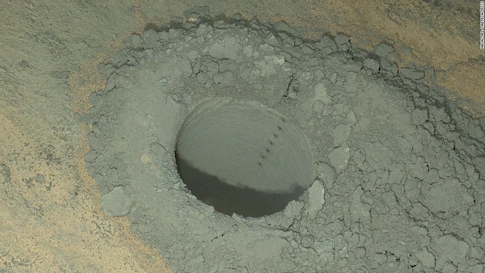 Curiosity took this nighttime photo of a hole it drilled May 5 to collect soil samples. NASA said this image combines eight exposures taken after dark on May 13.