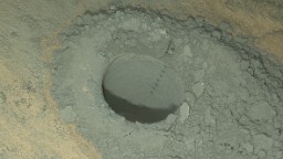 Curiosity took this nighttime photo of a hole it drilled to collect soil samples. NASA said this image combines eight exposures taken after dark. 