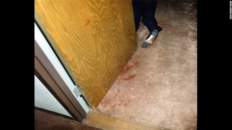 On October 16, 1986 police found the Moo Youngs&#39; bloody bodies in Room 1215 at Miami&#39;s Dupont Plaza Hotel. This police evidence photo shows one of the bodies in a doorway. 