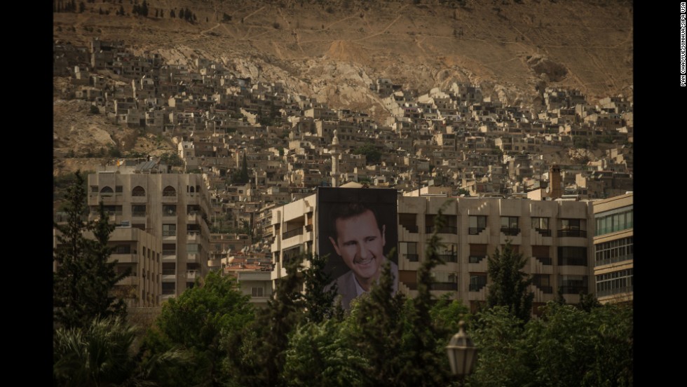 A giant poster of Syrian President Bashar al-Assad is seen in Damascus, Syria, on Saturday, May 31, as the capital prepares for presidential elections.