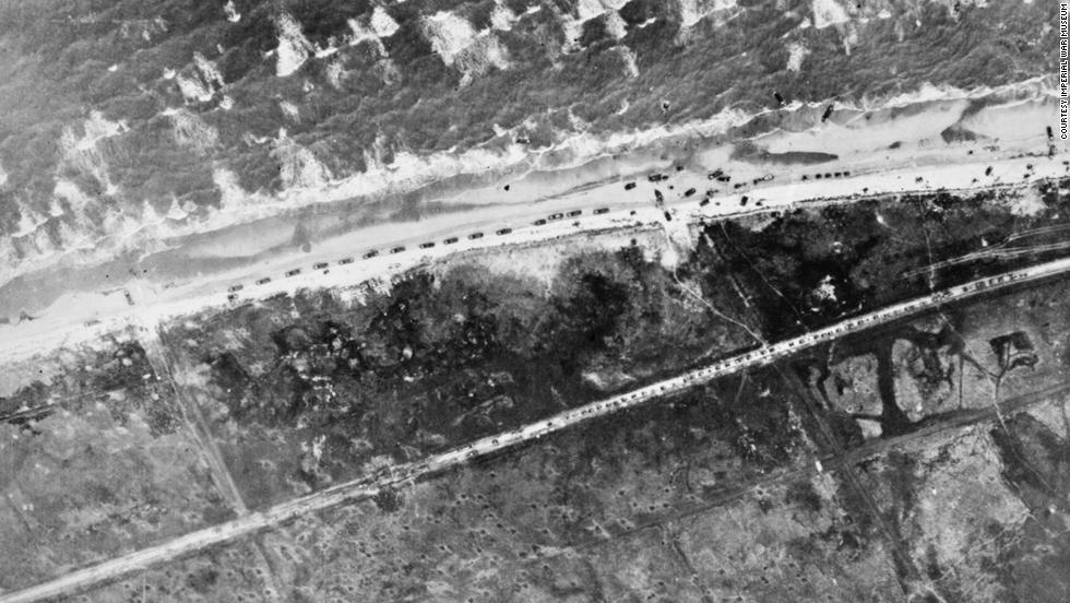 Traffic builds up on the beach and on the road leading to Le Hamel, France, during the landing of the 50th Infantry Division.