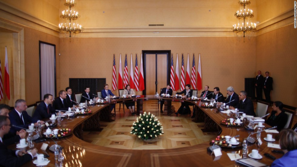 Obama, at right, is seated with a U.S. delegation as he participates in a bilateral meeting with Polish Prime Minister Donald Tusk and the Polish delegation in Warsaw on June 3. While in Poland, Obama announced he would ask Congress for $1 billion to be put toward bolstering NATO&#39;s security alliance in Europe.
