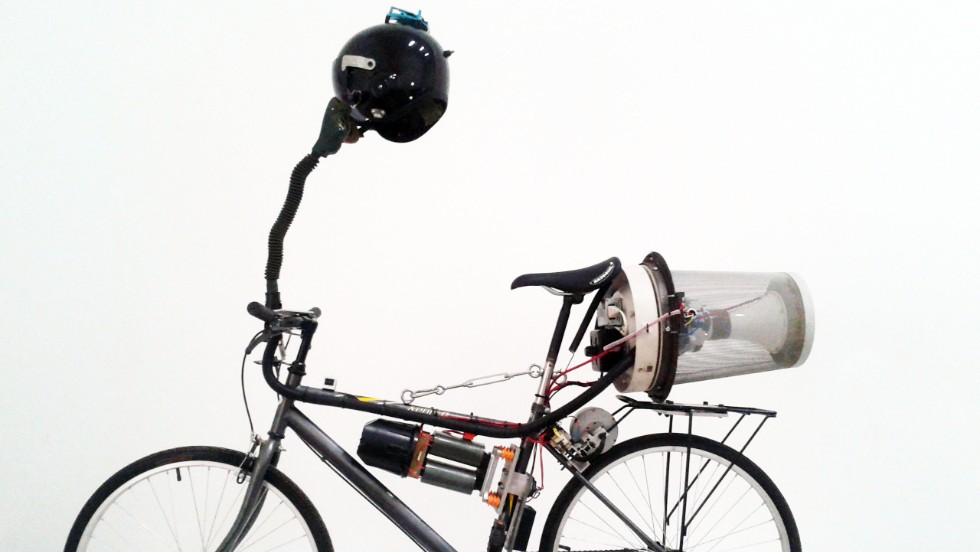 British artist Matt Hope attached a small generator to a bike&#39;s back wheel and as he pedals, electricity is produced to power his homemade filtration system. He says it&#39;s &quot;an ironic commentary about living in China.&quot;