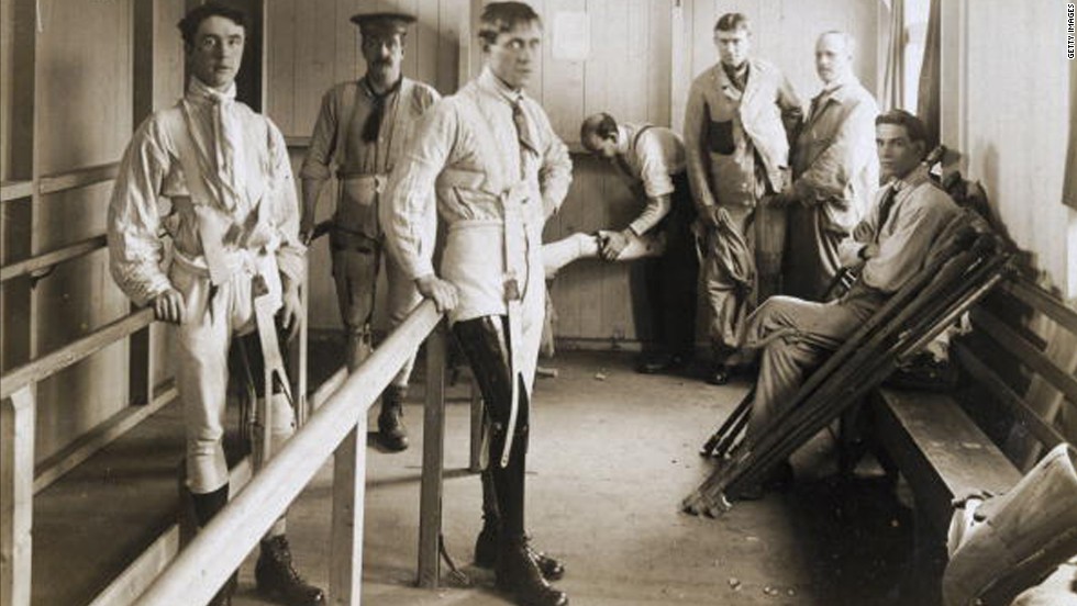 Postcard of British soldiers using parallel bars to help them learn to walk with their artificial legs. Image was probably taken at Queen Mary&#39;s Convalescent Auxiliary Hospital, a specialized orthopedic hospital that opened in London in 1915. 