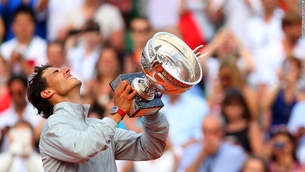 Rafael Nadal celebrates with the Musketeers&#39; Trophy after defeating Novak Djokovic in the French Open final Sunday, June 8, in Paris. Nadal, the top-ranked tennis player in the world, has now won 14 major tournaments and nine of the last 10 French Opens.