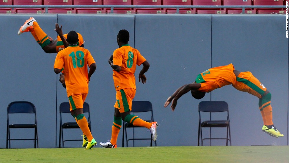 Zambia&#39;s Christopher Katongo, far left, flips in the air after scoring a goal against Japan in an international friendly match Friday, June 6, in Tampa, Florida. Japan won 4-3 in what was its final warm-up match for the World Cup.