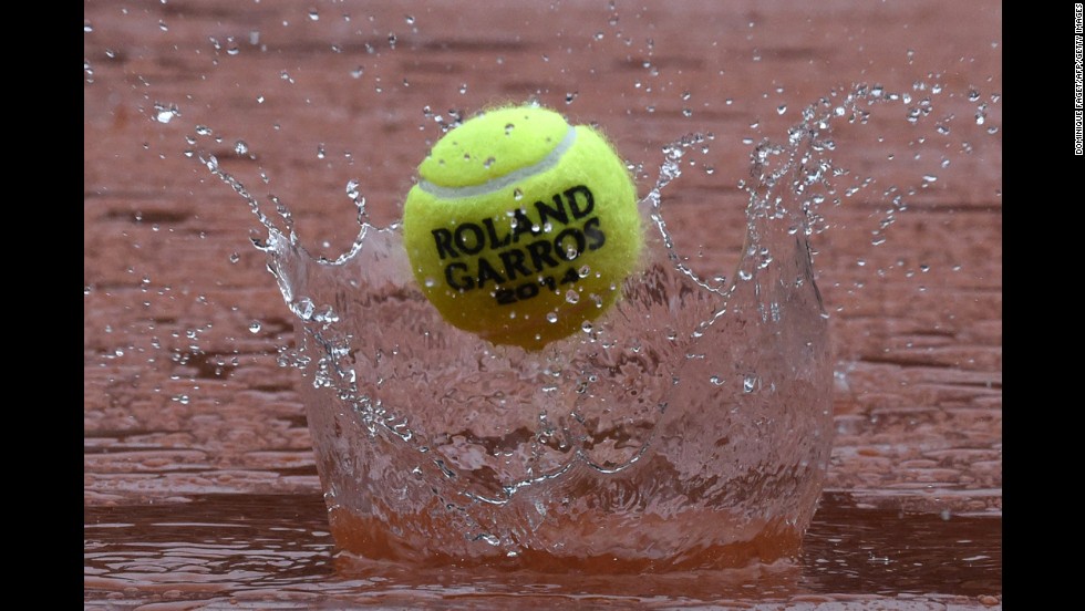 During a rain delay at the French Open, a tennis ball rebounds off the tarp covering the Philippe Chatrier court Wednesday, June 4, at the Roland Garros tennis complex in Paris. 