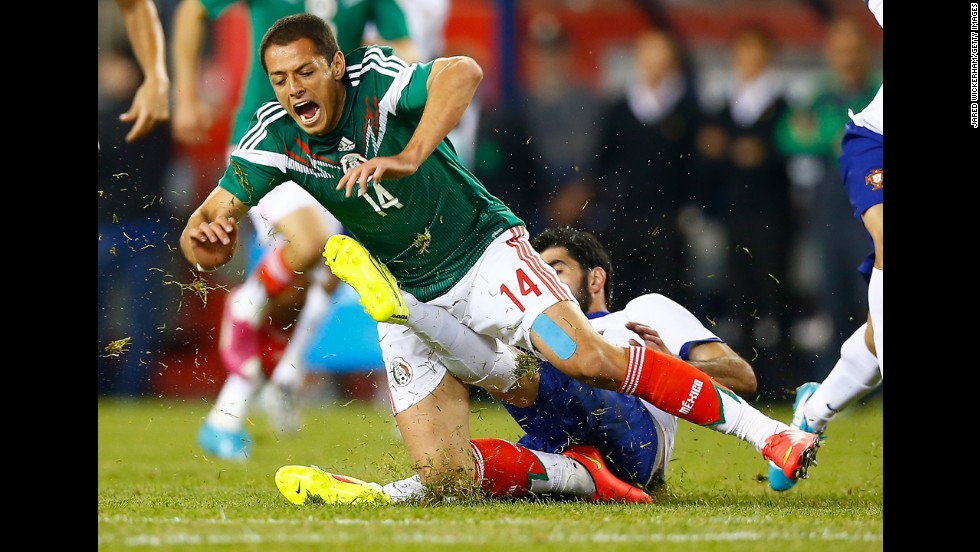 Mexico&#39;s Javier Hernandez is fouled by Portugal&#39;s Neto during an international friendly match Friday, June 6, in Foxborough, Massachusetts. Portugal won 1-0 on a goal by Bruno Alves. Both teams will be playing in the World Cup. 