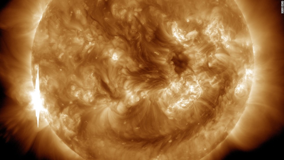 NASA captured this second flare, which appears as a bright flash on the left side of the sun, on June 10, 2014.