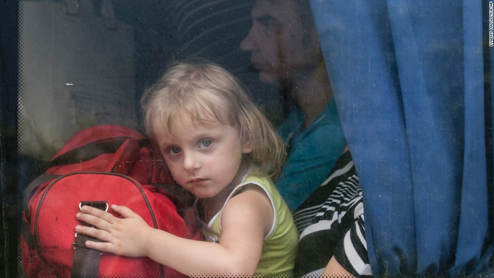 A girl looks out of a bus window as she leaves Slovyansk on Monday, June 9.