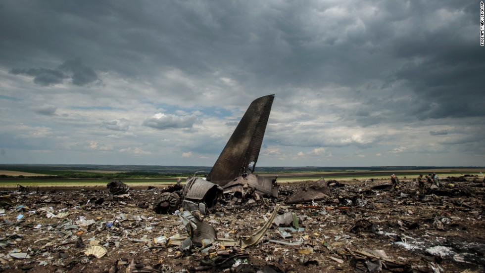 Debris lies scattered at an airport in Luhansk, Ukraine, on Saturday, June 14, after the crash of a Ukrainian Ilyushin-76 military transport plane. A military spokesman said the aircraft was shot down by pro-Russian separatists, killing all 49 aboard. 