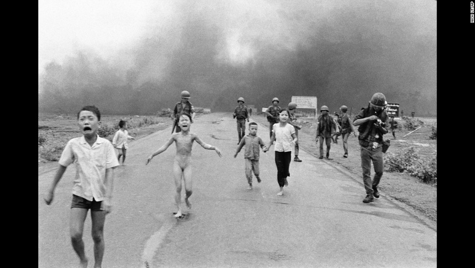 Associated Press photographer Nick Ut photographed terrified children running from the site of a Vietnam napalm attack in 1972. A South Vietnamese plane accidentally dropped napalm on its own troops and civilians. Nine-year-old Kim Phuc, center, ripped off her burning clothes while she ran. The image communicated the horrors of the war and contributed to growing U.S. anti-war sentiment. After taking the photograph, Ut took the children to a Saigon hospital.