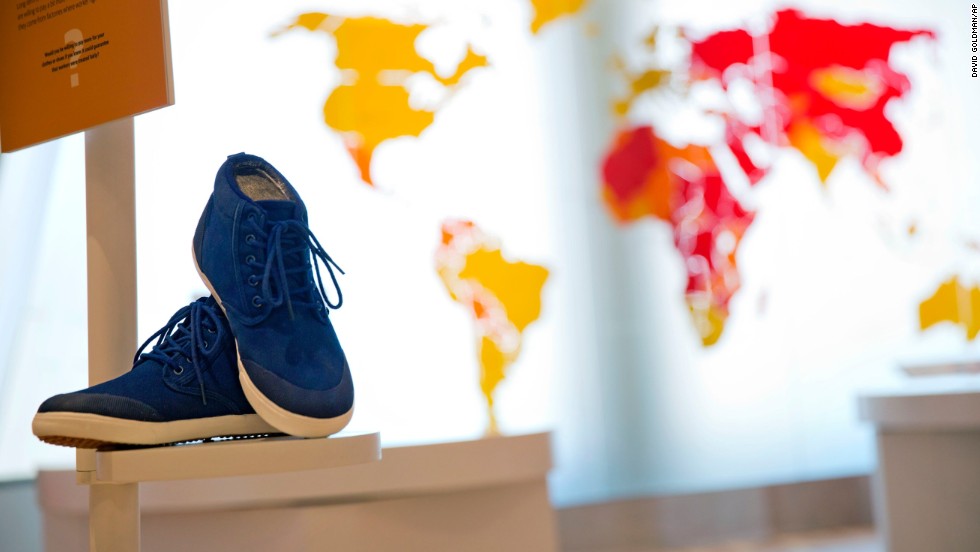 A pair of sneakers are displayed as part of an exhibit exploring the ethical footprint of common consumer products. The museum explores human rights struggles beyond the civil rights movement.
