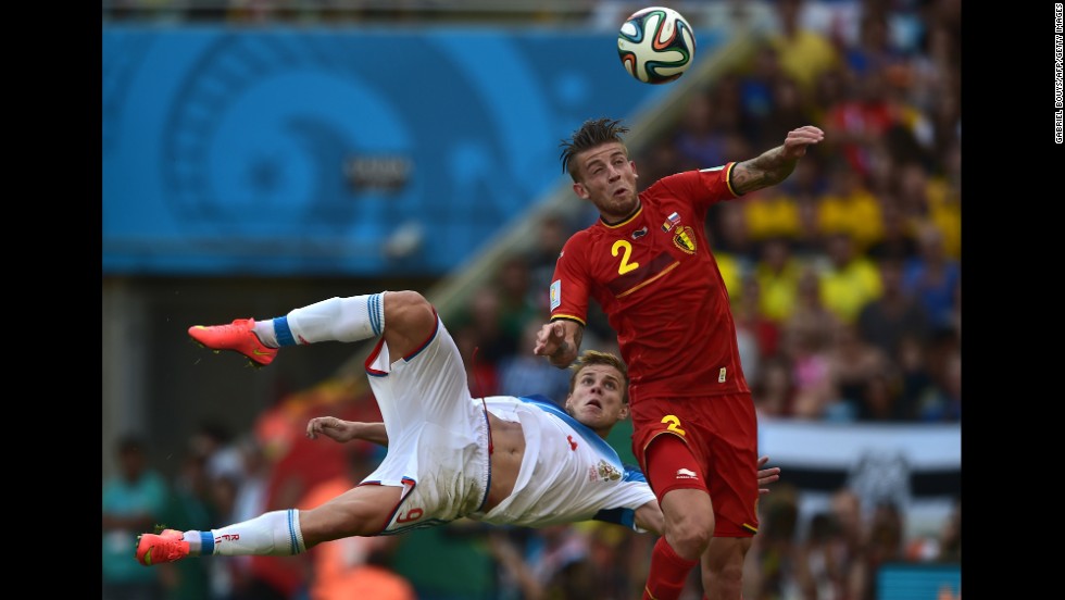 Belgian defender Toby Alderweireld heads the ball past Russian forward Alexander Kokorin.