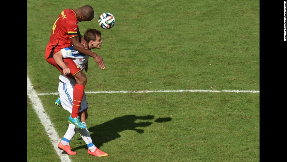 Belgian defender Vincent Kompany heads the ball past Russia&#39;s forward Alexander Kokorin.