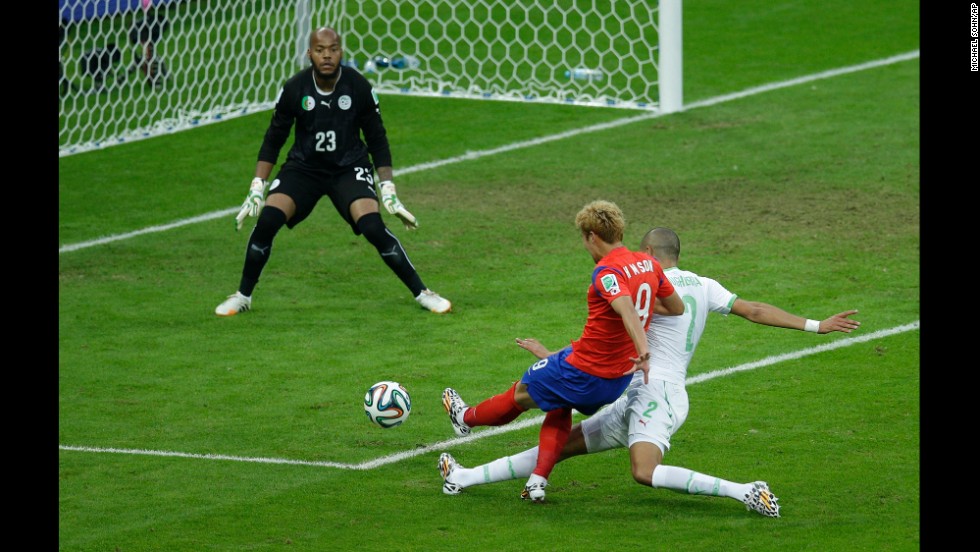 South Korea&#39;s Son Heung-min shoots and scores his team&#39;s first goal.