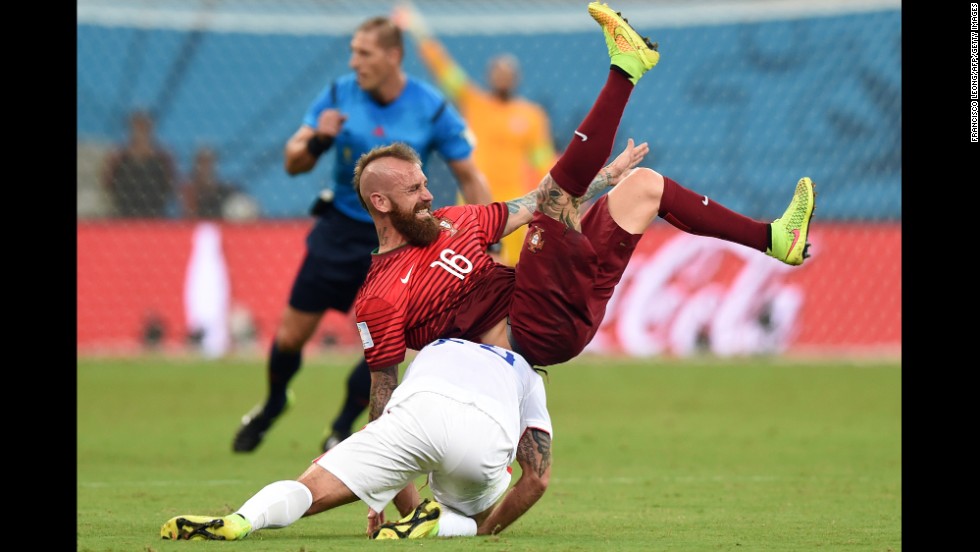 Portugal midfielder Raul Meireles and U.S. midfielder Kyle Beckerman tumble during the June 22 match in Manaus, Brazil.