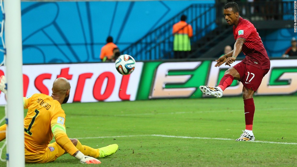 Nani of Portugal scores his team&#39;s first goal past U.S. goalkeeper Tim Howard. Portugal took a 1-0 lead in the fifth minute of the match.