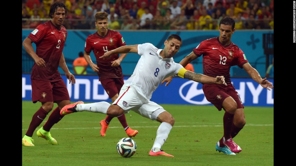 Clint Dempsey is challenged by several Portugal players during the action on June 22.