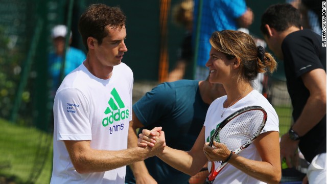 Murray talks with Mauresmo during a practice session for Wimbledon in 2014.