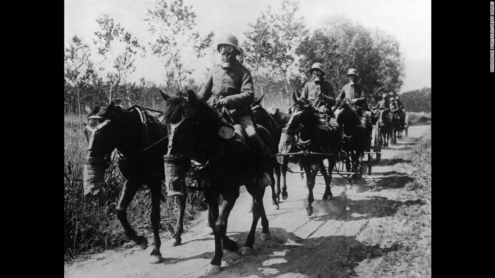 A German cavalry unit with both horses and soldiers wearing gas masks advances during the Second Battle of the Aisne at Soissons, France, in June 1918.