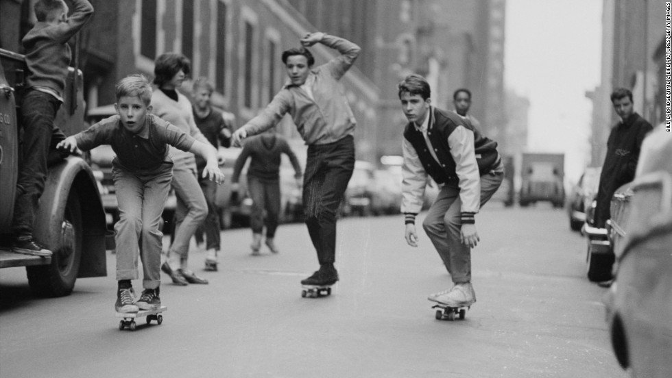 Skateboards had just started to take off in 1963, after onetime California lifeguard Larry Stevenson perfected a wheeled version of the surfboard. During the summer of 1964, the boards spread around the United States. Here, boys skate past cars on the streets of New York in 1965.