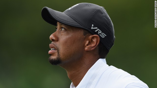 Tiger Woods looks on anxiously after hitting a shot during his second round at the Congressional tournament.