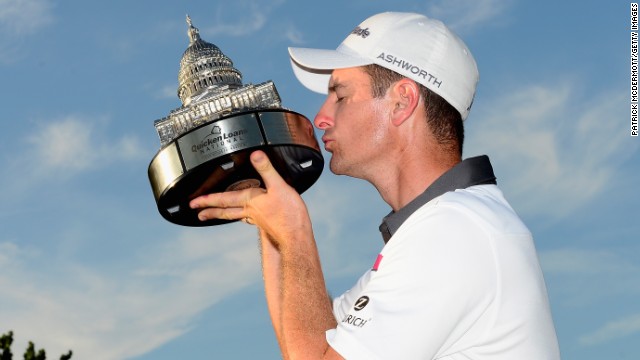 Kiss from a Rose: The 2013 U.S. Open winner celebrates after his triumph at Congressional.