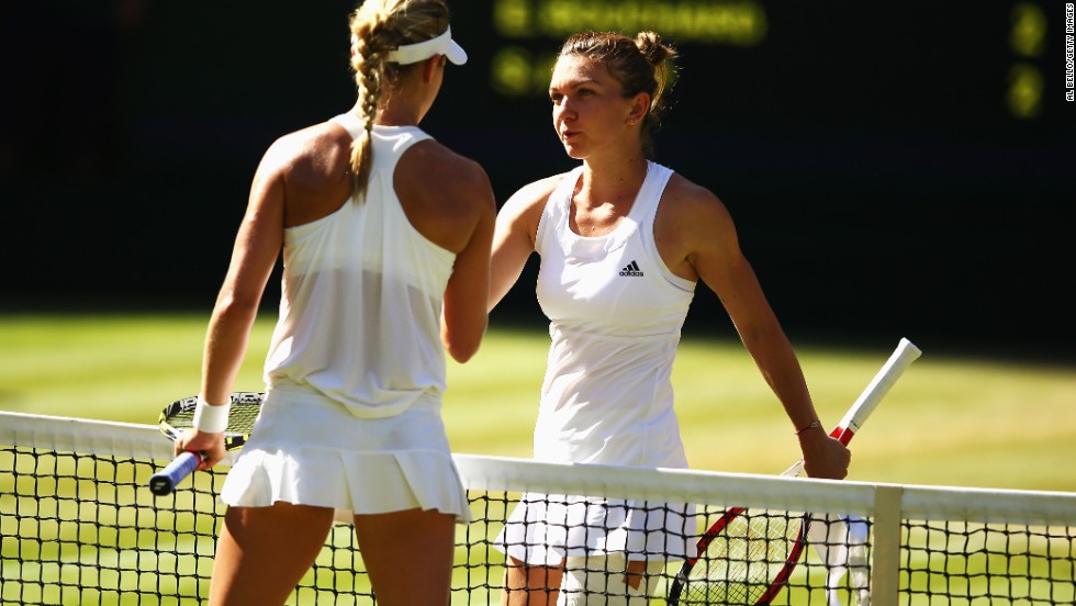 Bouchard and Halep shake hands at the end of their semifinal clash.