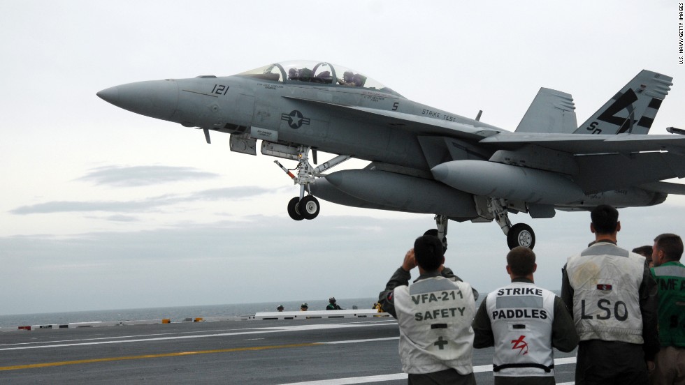 An F/A-18 Hornet is pictured aboard the USS George H.W. Bush on May 19, 2009. The F/A-18 Hornet, a late-&#39;70s contemporary of the Air Force&#39;s F-16 Fighting Falcon, became the workhorse of U.S. carrier-based air power and still supplements the Navy&#39;s and Marines&#39; more current fleet of F/A-18E and F/A-18F Super Hornets. It is designed as both a fighter and an attack aircraft.