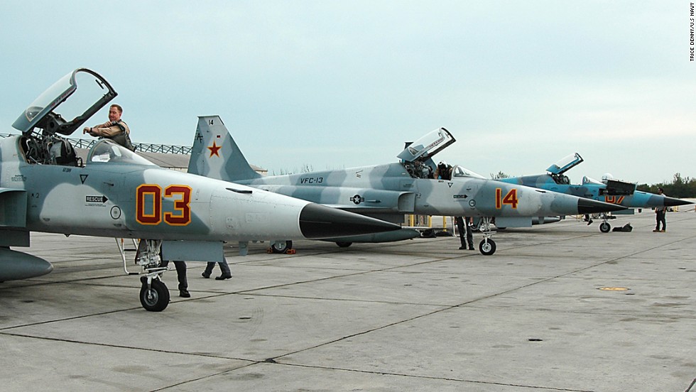 Pilots perform daily flight checks on their F-5E/F Tiger aircraft in Key West, Florida, on January 7, 2005. The Vietnam-era aircraft -- one of several offshoots of the original Northrup F-5s that went into service in the early 1960s -- is used to simulate adversary aircraft in training.